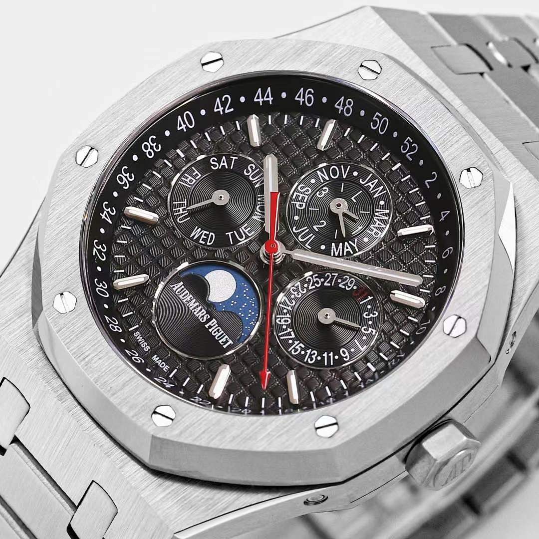 Royal Oak watch dial close-up with black face, red seconds hand, and multiple subdials