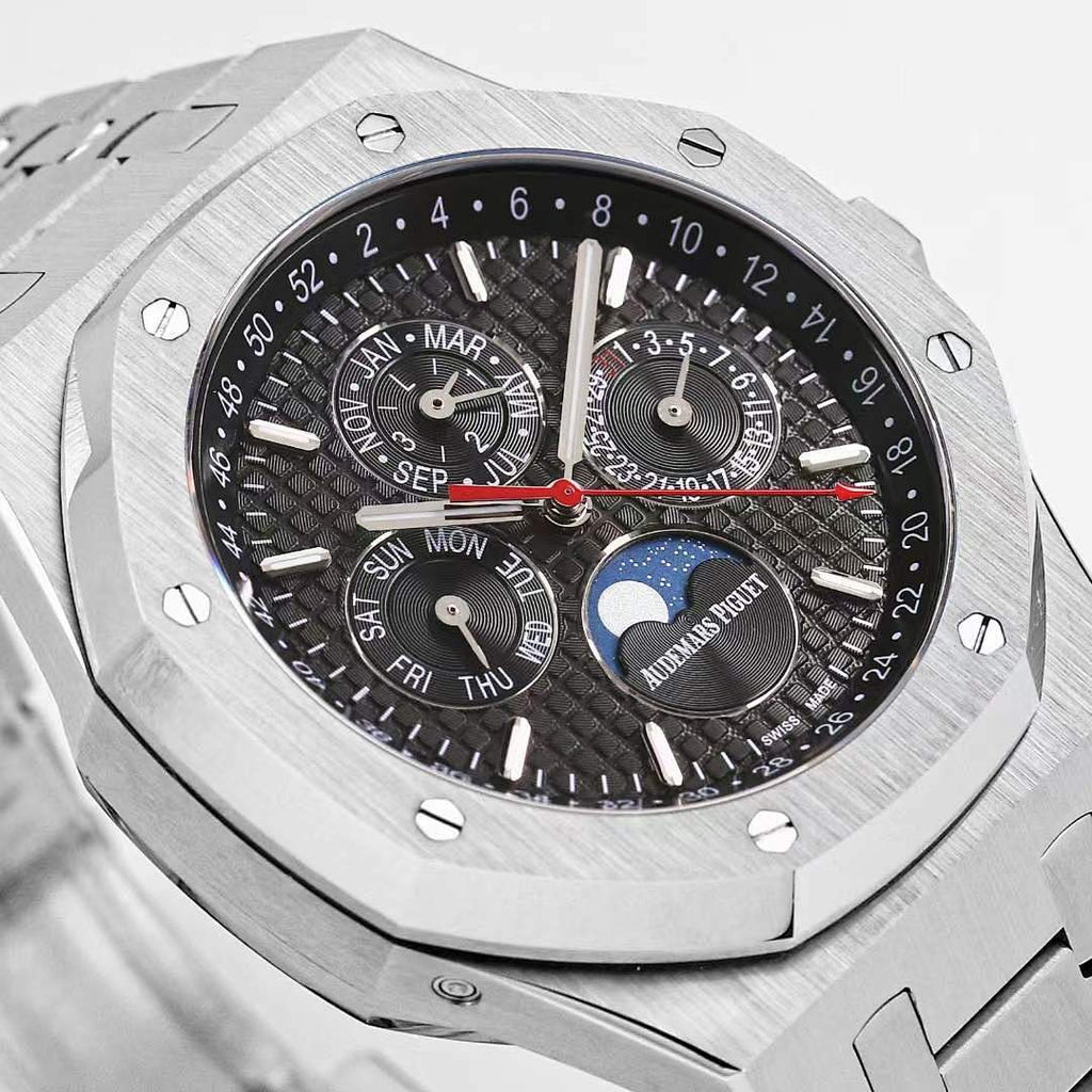 Royal Oak watch dial close-up with black dial, red seconds hand, and date-style subdial
