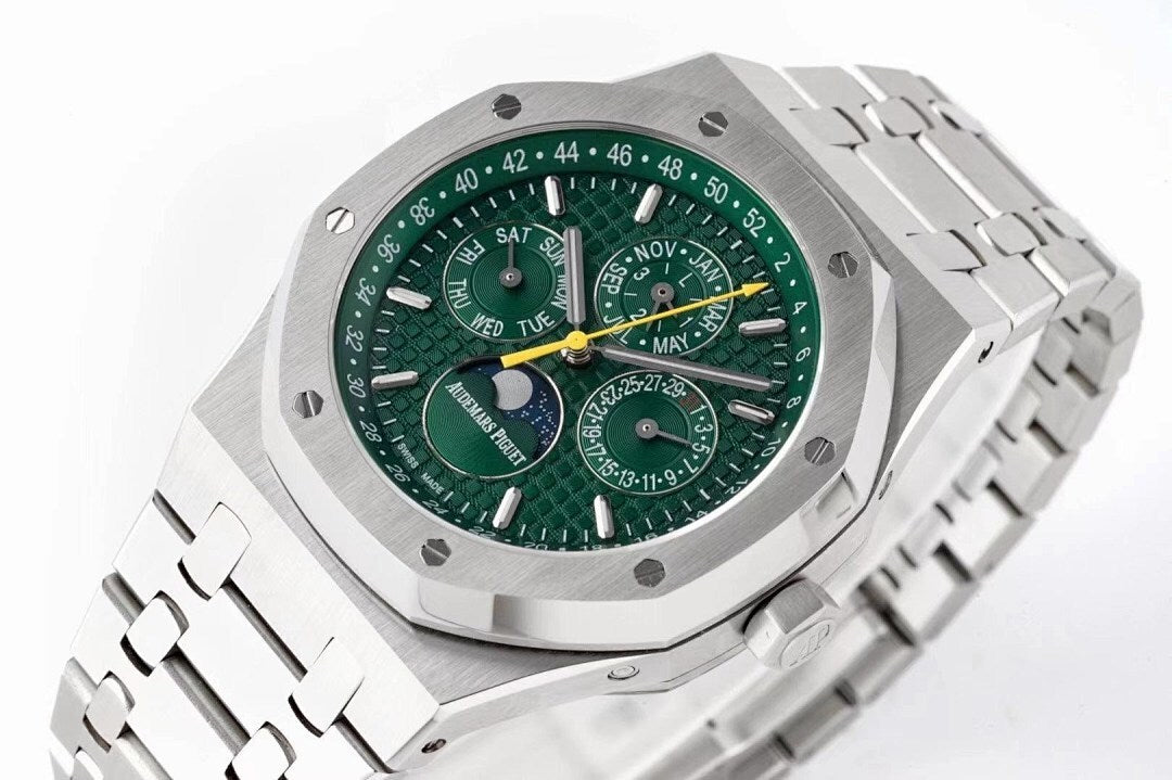 Octagonal stainless steel watch with green dial and linked bracelet, angled view