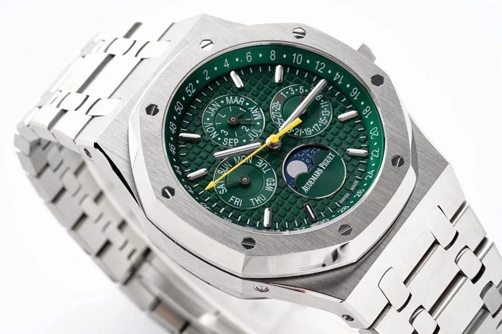 Stainless steel watch face close-up with green dial and multiple subdials