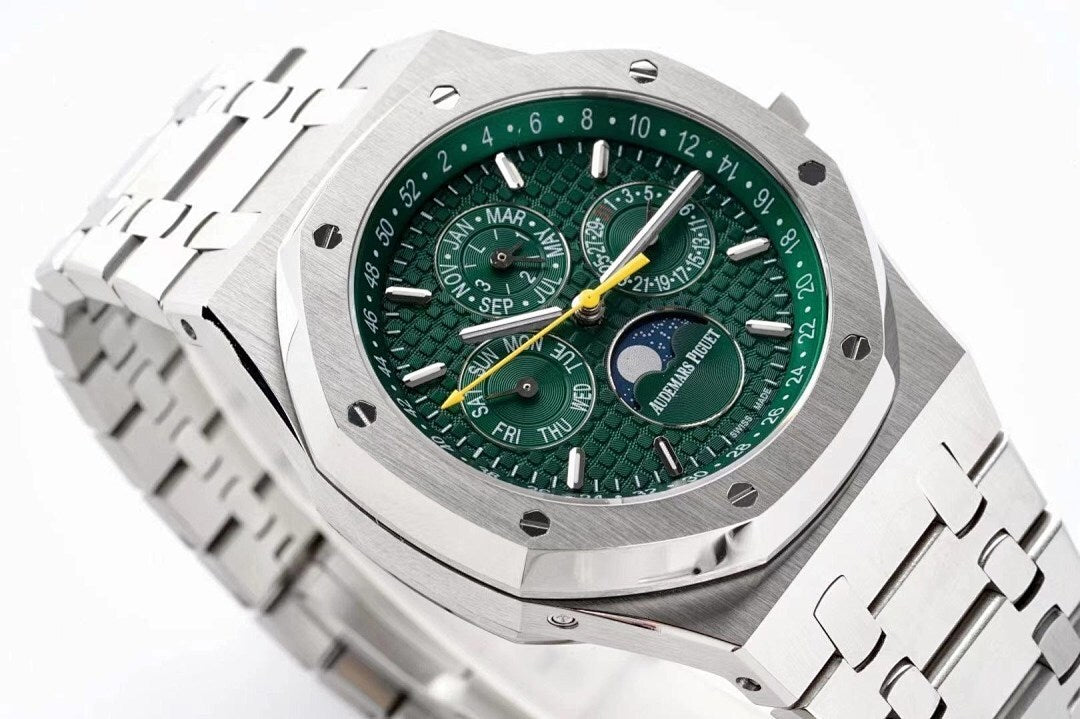 Stainless steel watch face close-up with green dial and multiple subdials