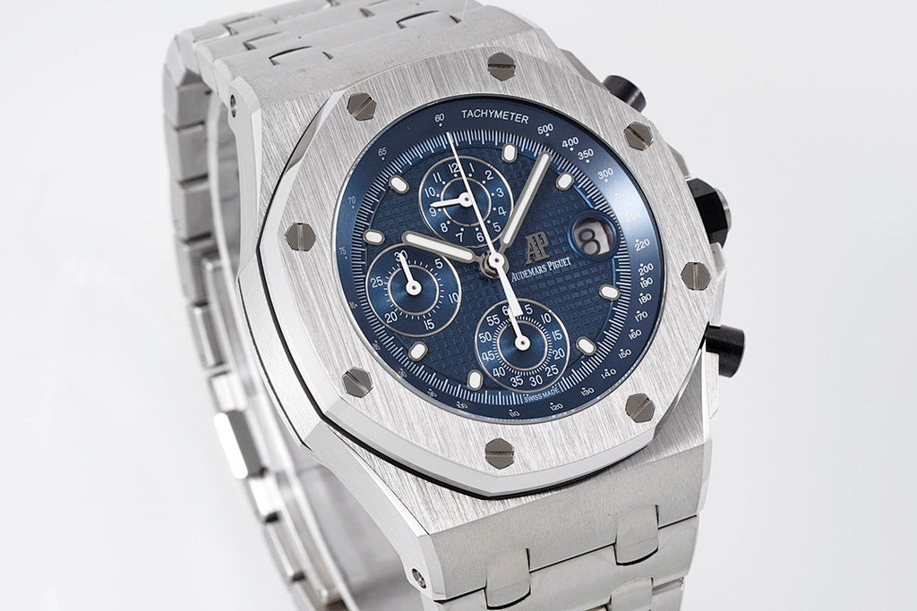 Audemars Piguet stainless steel watch with blue chronograph dial and steel bracelet.