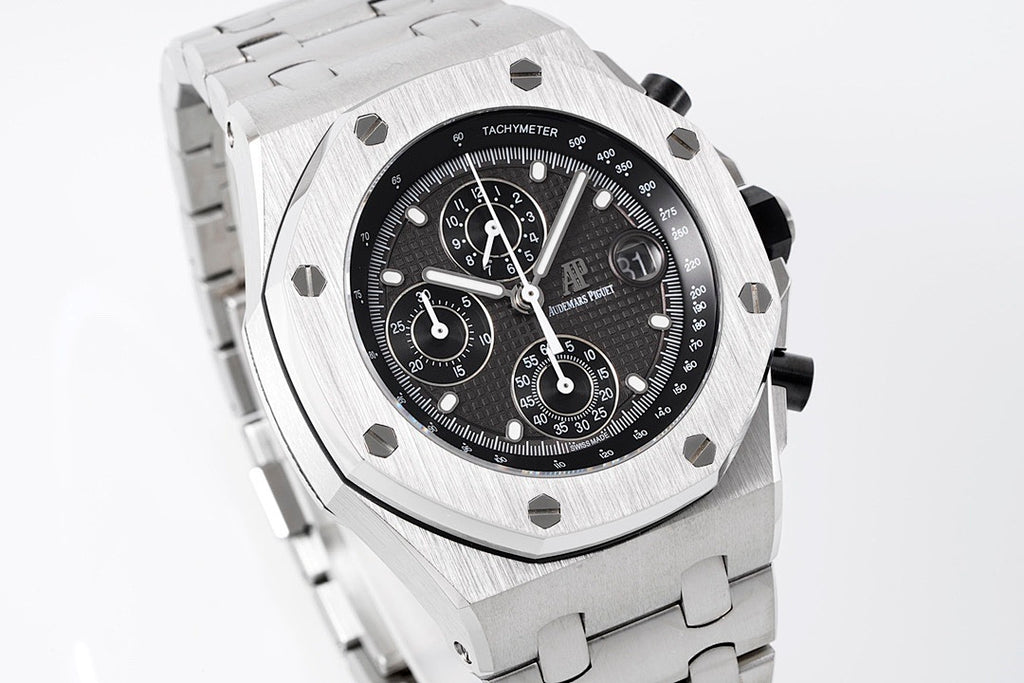 Stainless steel chronograph watch with black dial and tachymeter ring, metal bracelet