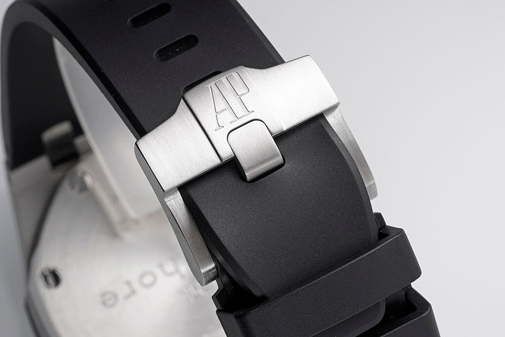 Audemars Piguet watch clasp with brushed metal buckle on black rubber strap