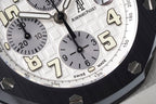 Audemars Piguet watch dial close-up with cream numerals and black subdials