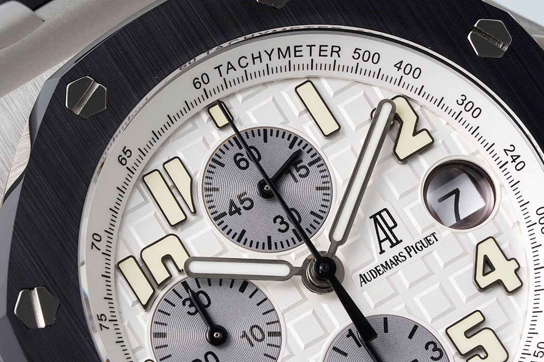 Audemars Piguet watch dial close-up with tachymeter scale and gold-tone indices