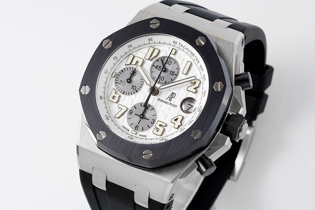 Audemars Piguet watch front angled with silver dial and black bezel on rubber strap
