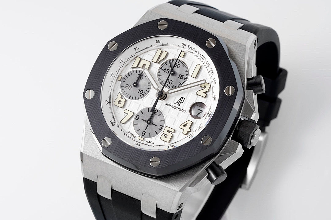 Audemars Piguet watch front angled with silver dial and black bezel on rubber strap