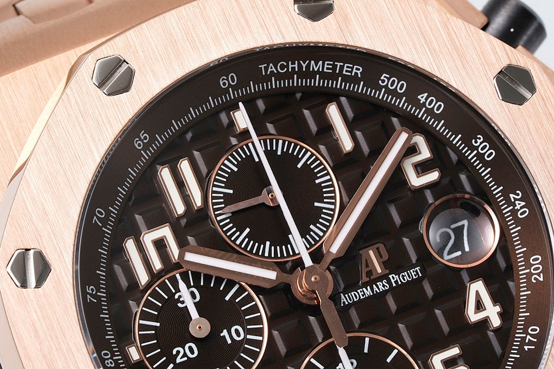 Audemars Piguet watch dial close-up with tachymeter markings and rose-gold hands