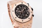 Audemars Piguet watch three-quarter view with rose-gold tone case and black chronograph dial