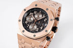 Rose-gold chronograph watch with black dial, subdials, and link bracelet