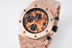 Audemars Piguet watch, front view with orange dial, black subdials, and rose-gold bracelet
