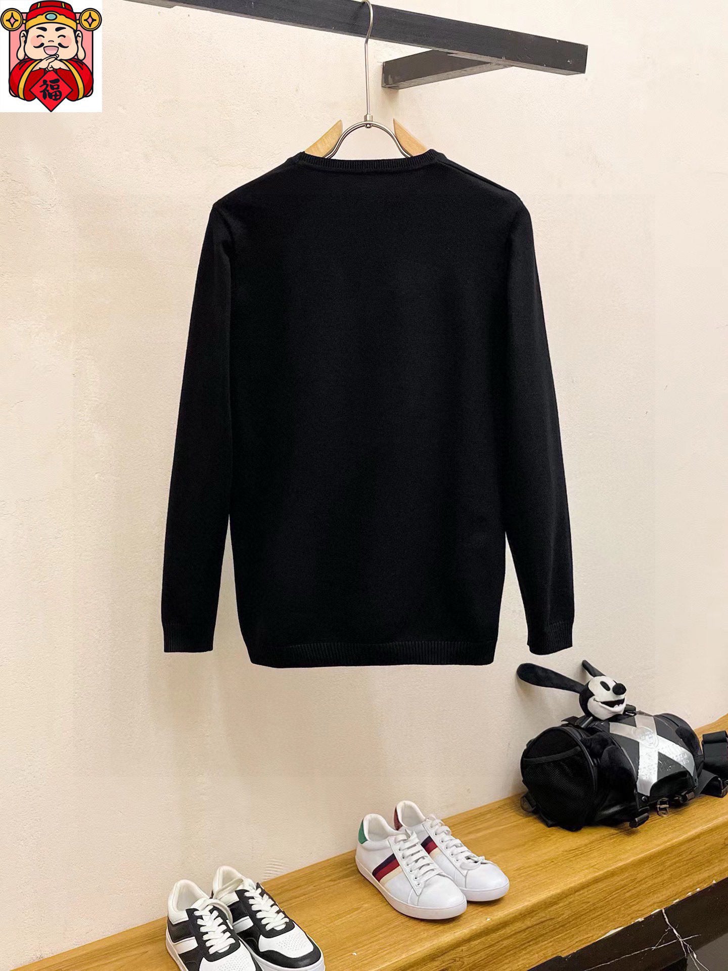 Black crewneck sweatshirt back view with long sleeves