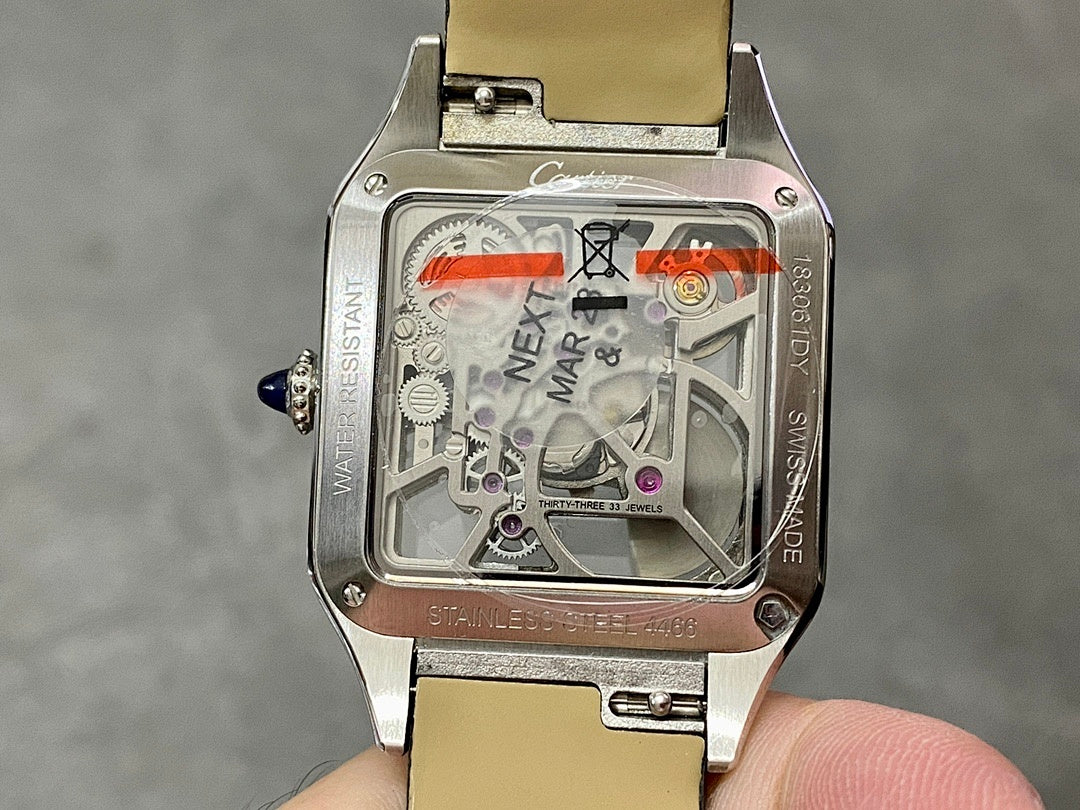 Square watch with silver-tone case, black strap, see-through dial with colorful markings