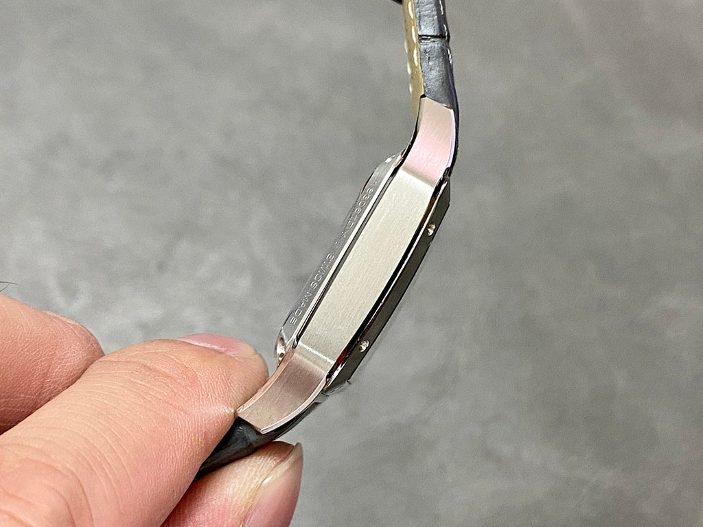 Side profile of a square watch case on a black leather strap
