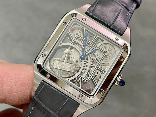 Square skeleton watch with silver-tone case, black leather strap, blue crown detail