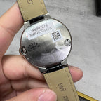 Wristwatch case back in silver tone with QR code, model numbers, and black strap.