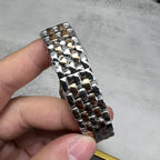 Cartier watch metal bracelet links in shiny silver with gold-toned accents