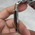 Cartier watch side profile in shiny silver metal with rounded case