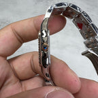 Cartier watch side profile with crown detail and shiny silver case