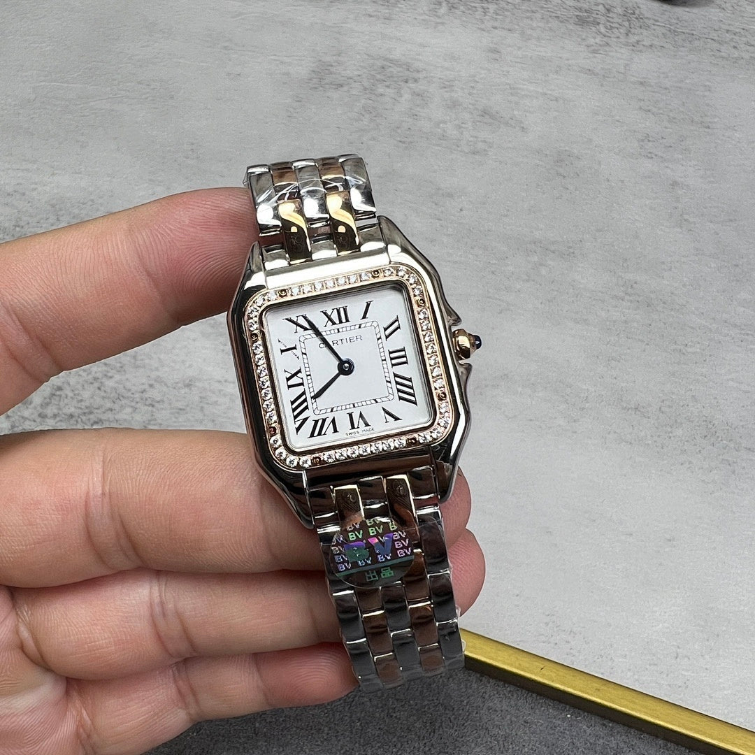 Cartier watch with rectangular white dial, Roman numerals, diamond bezel, metal bracelet