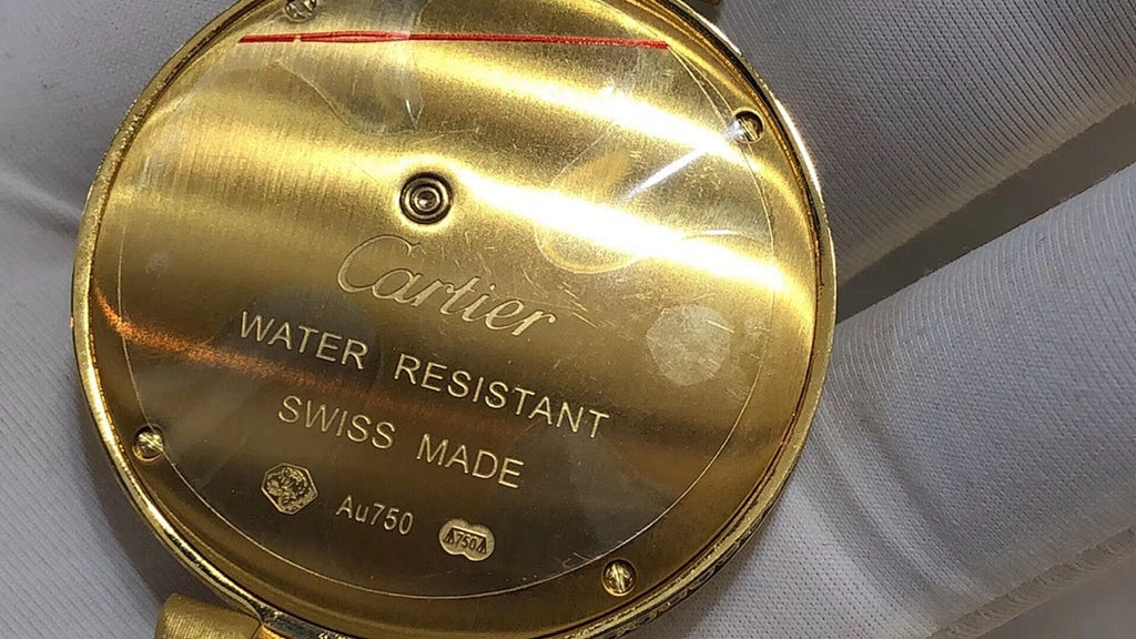 Cartier watch case back in gold-tone with Cartier logo and Water Resistant Swiss Made text