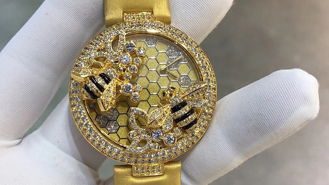 Cartier watch with gold-tone strap, round bezel with rhinestones, honeycomb dial and crystal details