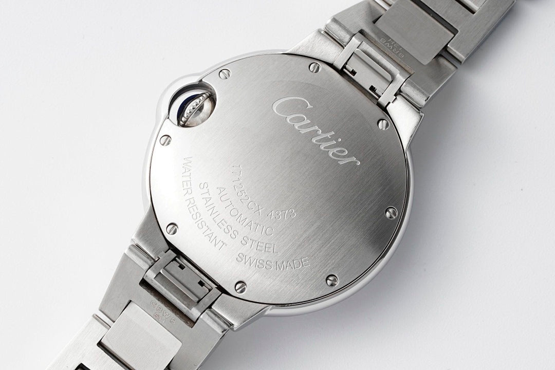 Cartier stainless steel watch case back with crown and engraved text