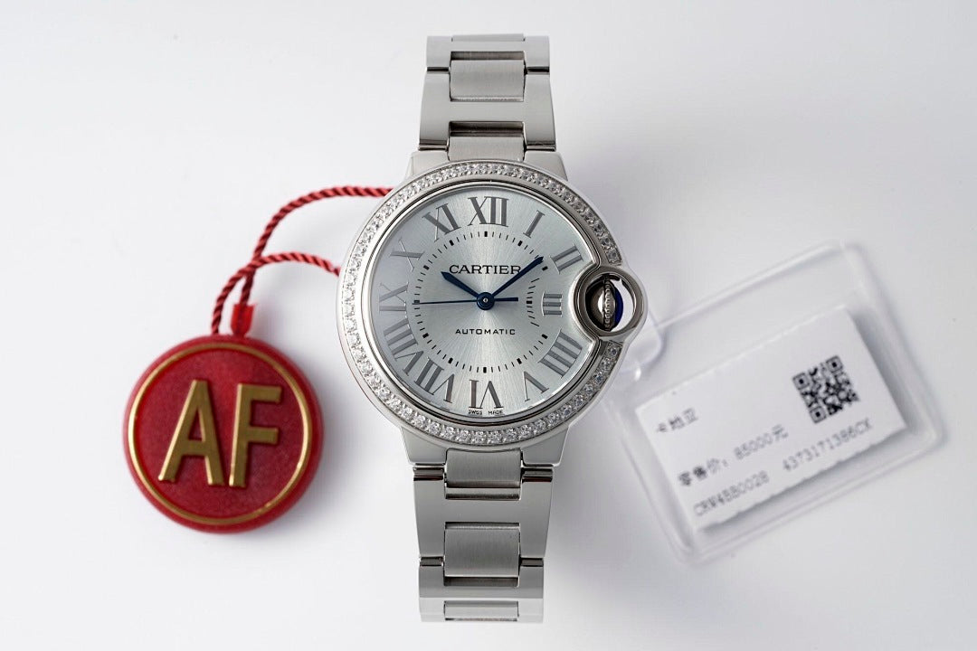 Cartier stainless steel wristwatch with silver dial and red AF charm