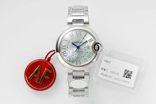Cartier watch with silver dial, steel bracelet, and red AF charm with card
