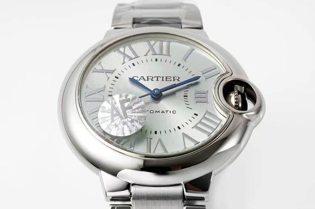 Cartier watch close-up of white-silver dial with Roman numerals