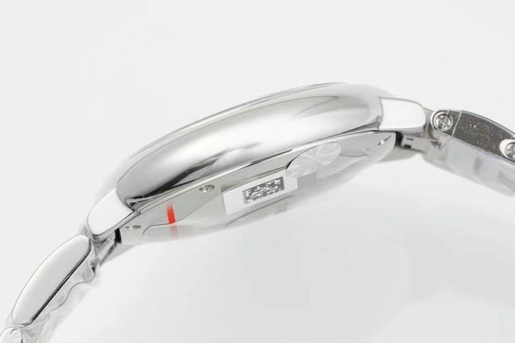 Cartier watch side profile, polished silver case and crown, link bracelet