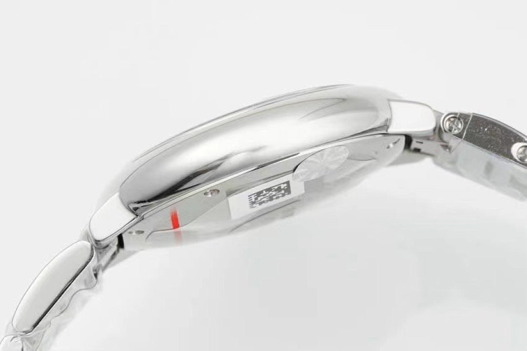 Cartier watch side profile, polished silver case and crown, link bracelet