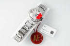 Cartier watch front view, silver bracelet, white dial, red AF tag, paperwork