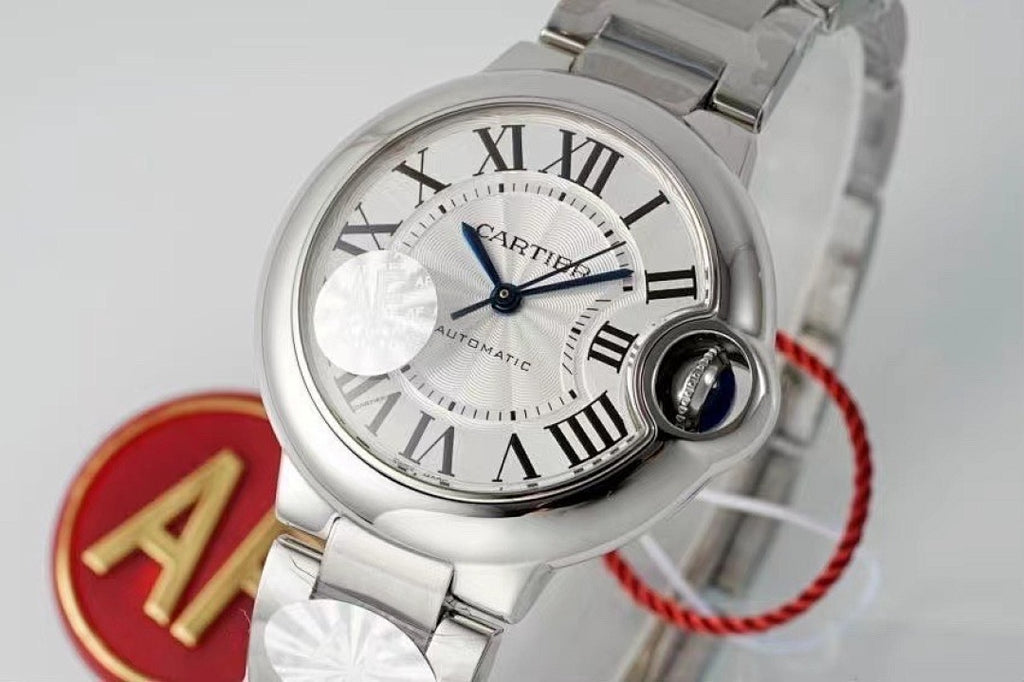Cartier watch close-up, white dial with blue seconds hand, silver case, red cord