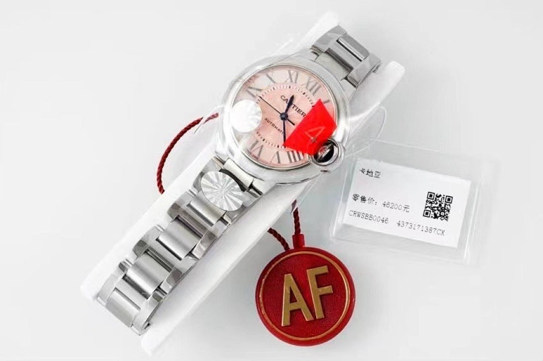 Cartier automatic wristwatch with silver bracelet, pink dial, and red AF tag