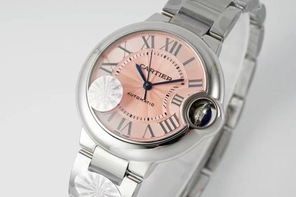 Cartier wristwatch with light pink dial, roman numerals, and silver metal bracelet