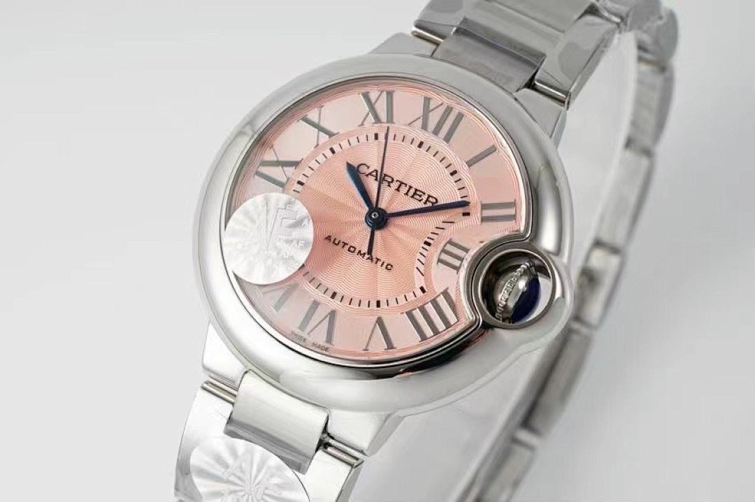 Cartier wristwatch with light pink dial, roman numerals, and silver metal bracelet