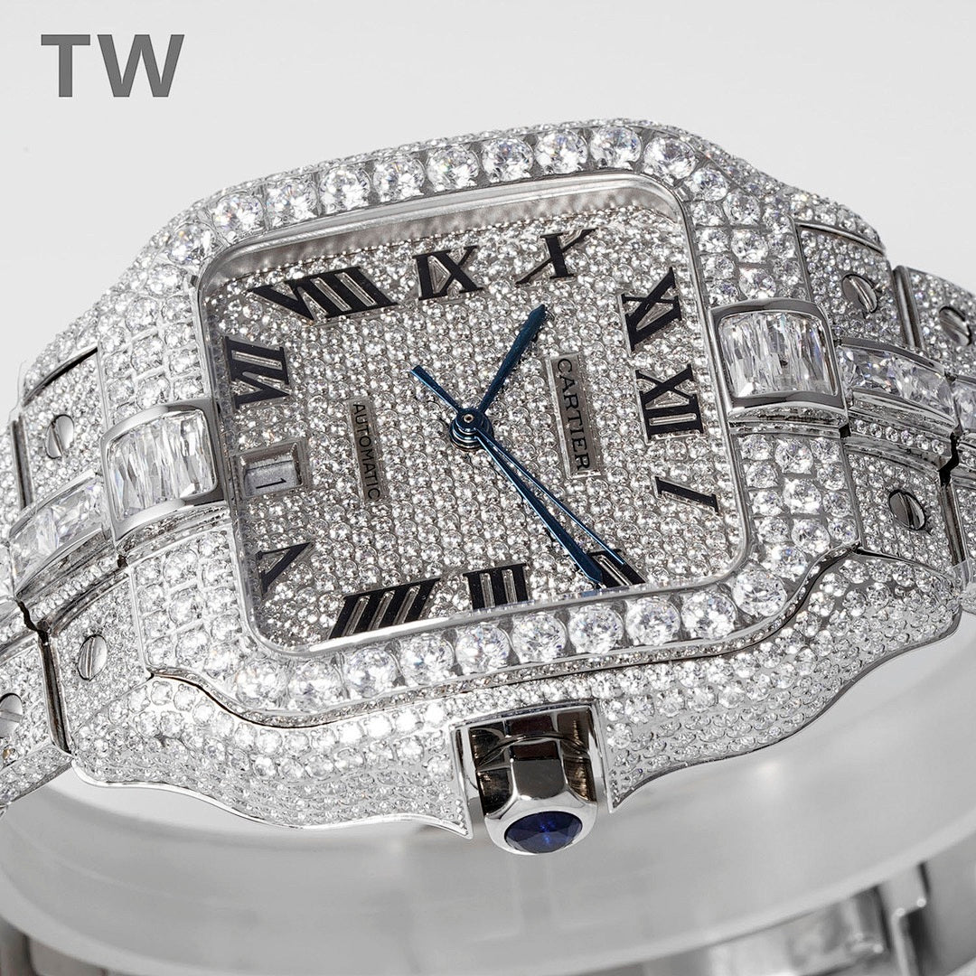 Diamond-studded rectangular wristwatch with Roman numerals, blue hands, and metal bracelet.
