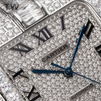 Close-up of diamond dial featuring Cartier mark, Roman numerals, and blue hands.