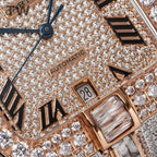 Cartier watch dial close-up with diamond pavé, “AUTOMATIC” text and date window