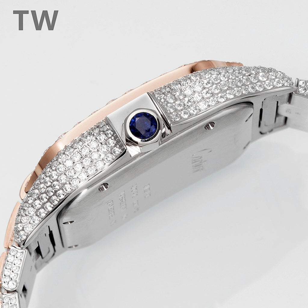 Cartier diamond watch side view with blue gem crown, rose-gold accents, studded bezel