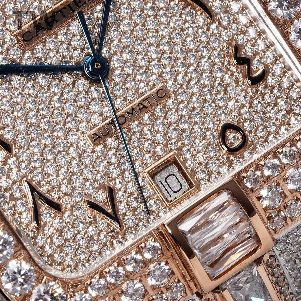 Cartier diamond watch dial close-up with blue sword hands, gem indexes, rose-gold trim