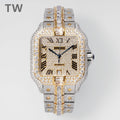 Cartier watch with gold and silver pavé diamonds, Roman numerals, and two-tone bracelet.