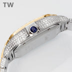 Cartier watch with diamond bezel, gold frame, and blue sapphire stone on the dial.