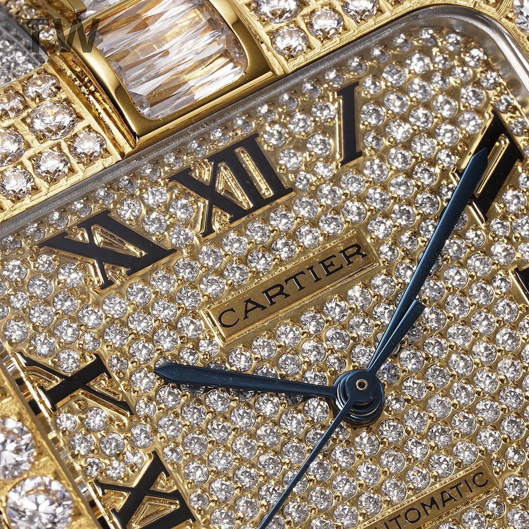 Cartier watch dial close-up with Cartier logo, diamond pavé, and Roman numerals.