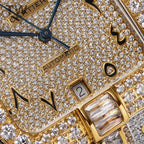 Cartier jeweled dial close-up with Automatic text and gold markers