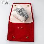 Cartier watch resting on red presentation pouch, rectangular diamond-like case and bracelet