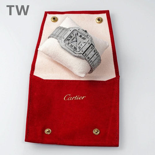 Cartier watch resting on red presentation pouch, rectangular diamond-like case and bracelet