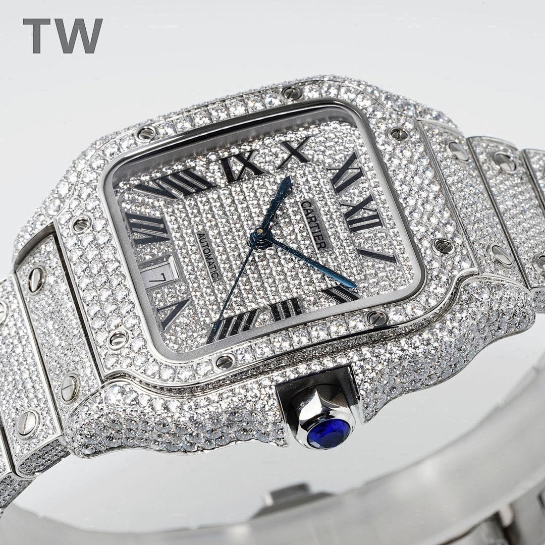 Diamond-set rectangular watch with Roman numerals, blue hands, and blue cabochon